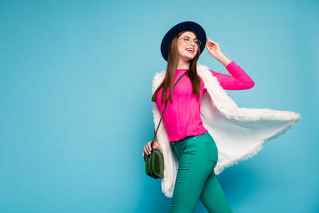 Portrait of her she nice attractive lovely charming cheerful cheery girl traveling walking spending weekend free time isolated on bright vivid shine vibrant green blue turquoise color backgroundの写真素材