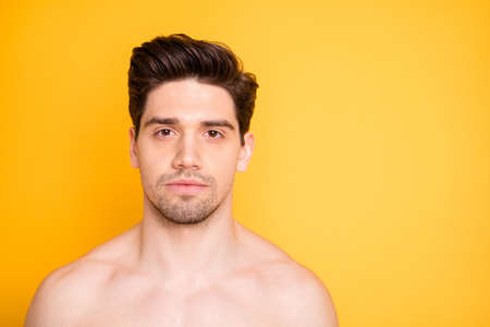 Close up photo of serious handsome man visit spa salon skincare treatment feel masculine isolated over yellow color backgroundの写真素材
