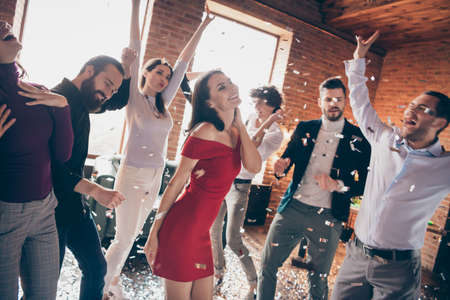Photo of fellows friends dance floor x-mas students party carefree mood favorite youth song overjoyed resting together wear formalwear red dress shirts restaurant place indoorsの写真素材