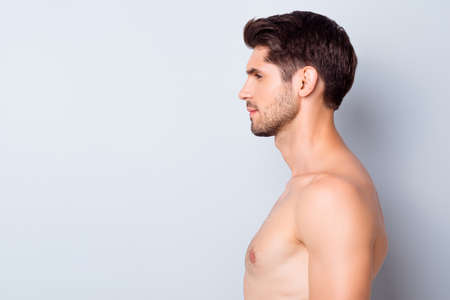 Close-up profile side view portrait of his he nice attractive content well-groomed calm brunette guy perfect smooth soft skin spa therapy isolated over light white grey color pastel backgroundの写真素材