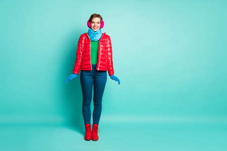 Full length photo of funny traveler lady enjoy sunny winter day rejoicing wear stylish casual red...