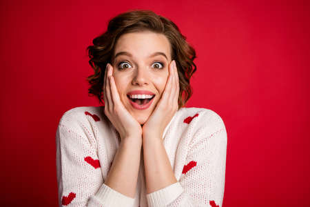 Close up photo of funny cheerful positive girl look incredible romantic date novelty impressed touch hands cheeks scream isolated over bright color backgroundの写真素材