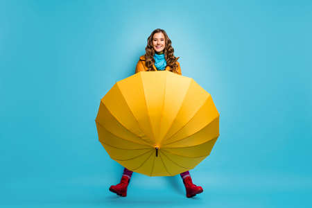 I dont need it. Full length photo of pretty lady hold umbrella enjoy spring sunny day street wear...