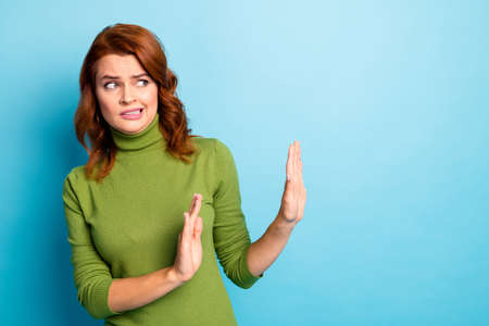Close-up portrait of her she nice attractive lovely scared afraid wavy-haired girl showing no sign aside isolated over bright vivid shine vibrant blue turquoise teal color backgroundの写真素材