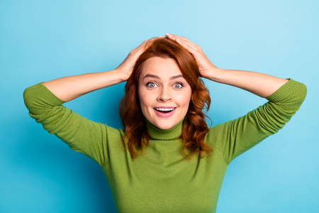 Close-up portrait of her she nice attractive cheerful cheery glad wavy-haired girl enjoying vacation good news mood isolated over bright vivid shine vibrant green blue turquoise teal color backgroundの写真素材