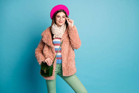 Portrait of her she nice-looking attractive lovely pretty well-dressed confident intelligent girl posing touching specs isolated on bright vivid shine vibrant green blue turquoise color backgroundの写真素材