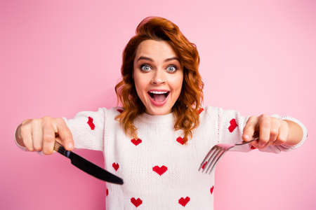 Close-up portrait of nice attractive addicted cheerful cheery foxy ginger wavy-haired girl holding...