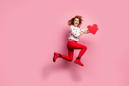 Full length body size view of nice attractive crazy glad cheerful cheery foxy ginger wavy-haired girl jumping running hurry rush gift congrats delivery isolated on pink pastel color backgroundの写真素材