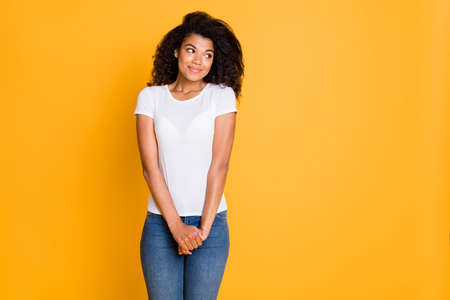 Photo of curly wavy cute nice pretty girlfriend hesitating to ask with hands folded in jeans denim looking into empty space isolated vibrant color backgroundの写真素材
