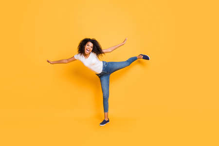 Full length body size photo of cheerful wavy curly trendy girl wearing jeans denim ecstatic...