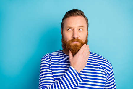Portrait of minded pensive ginger hair beard man look copyspace think thoughts want solve work...