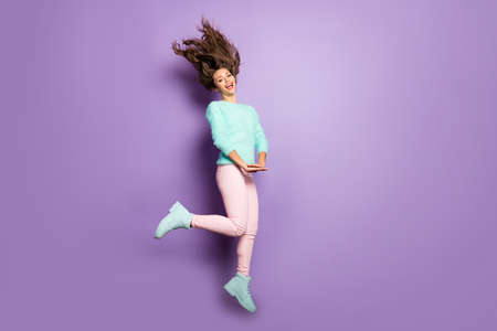 Full length profile photo of funky lady jump high up good mood rejoicing hairstyle flying wear fuzzy...