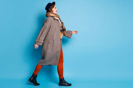 Full body profile photo of amazing trendy traveler lady walking down street abroad good mood wear...