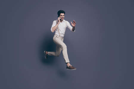 Full size profile side photo excited macho man speak phone talk listen black friday news jump run...