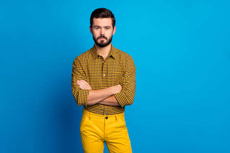 Portrait of strict clever intelligent manager guy cross hands ready decide work decision wear checkered outfit isolated over vibrant color backgroundの写真素材