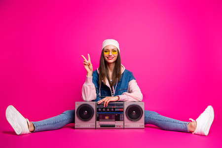 Portrait of her she nice attractive lovely cheerful cheery glad girl sitting next to boom-box...