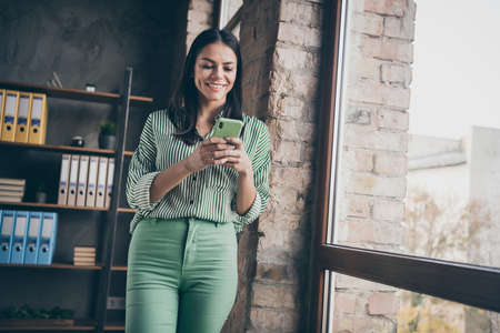 Portrait of her she nice attractive cheerful successful lady typing sms inviting candidate for...