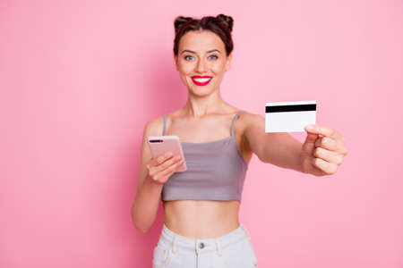 Portrait of charming positive girl use smartphone online shopping user pay purchase with credit card...