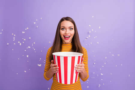 Close-up portrait of her she nice attractive pretty cute cheerful cheery glad girl holding in hands box corn flying dream day amusement isolated over violet purple lilac pastel color backgroundの写真素材