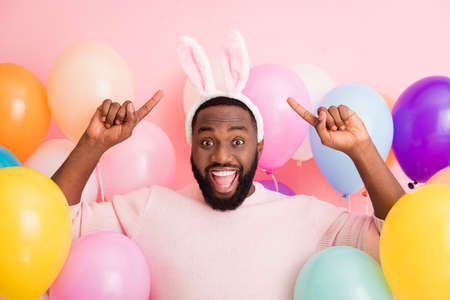 Photo of funny dark skin guy colorful decorations easter party festive, mood open mouth directing...