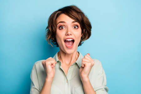 Closeup photo of funny excited lady raise fists screaming loudly celebrating money lottery winning...