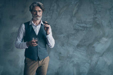 Portrait of brutal harsh masculine old dandy man hold cigar glass whiskey have relax work enterprise...