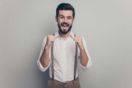 Portrait of crazy delighted collar modern ceo worker man get career development promotion news enjoy raise fists scream yes wear brown outfit isolated over grey color backgroundの写真素材