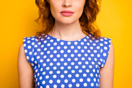 Cropped close-up view portrait of her she nice attractive lovely pretty, cute wavy-haired girl wearing pinup dress perfect plump lips isolated over bright vivid shine vibrant yellow color backgroundの写真素材