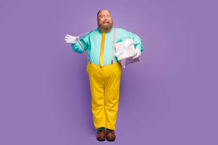 Full body photo energetic crazy funky man big abdomen hold dotted package box he give wife...