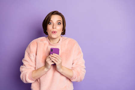 Photo of funny blogger lady holding telephone hands check blog enjoy many new followers subscribers...