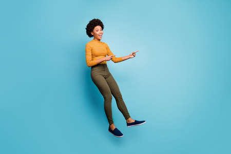 Full size photo of positive dark skin girl jump help choose decide advise feedback point index...