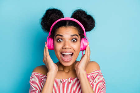 Closeup photo of funny nice dark skin lady listen music modern technology earphones open mouth...