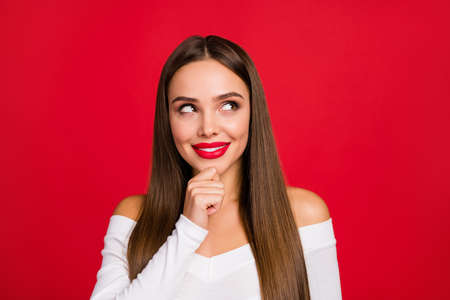 Portrait of inspired minded girl touch chin hand look copyspace think thoughts consider choose visit beauty party wear classy chic fancy outfit isolated over bright color backgroundの写真素材