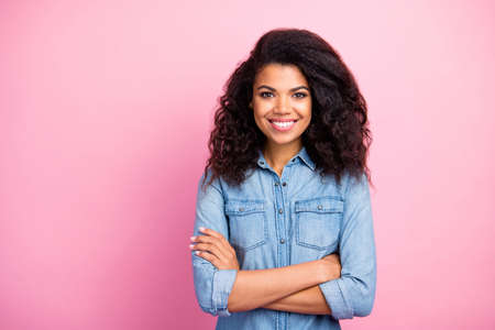 Portrait of cute sweet afro american girl cross hands feel she real freelancer wear good looking...