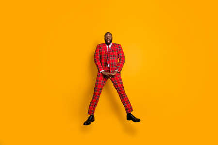 Full size photo of crazy funny dark skin guy jump high up spend free time leisure rejoicing wear...
