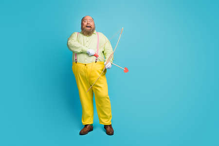 Full length body size view of his he nice funny funky dreamy kind cheerful cheery man cupid shooting...