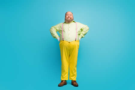 Full length body size view of his he nice funny cheerful cheery mature man wearing weird look isolated over bright vivid shine vibrant blue turquoise color backgroundの写真素材