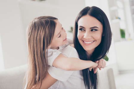 Closeup profile photo of cute small girl and young charming mom hugging piggyback inspiration...