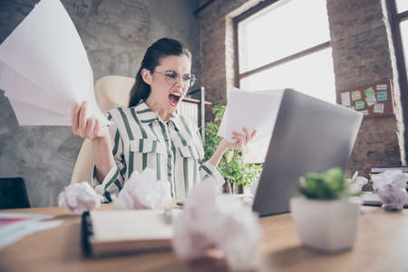 Frustrated aggressive furious girl executive marketer work laptop prepare start-up development...