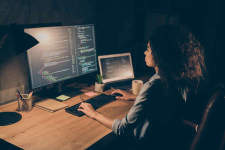 Focused skilled afro american girl it-specialist freelancer entrepreneur, sit desk table work...