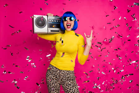Photo of crazy festive lady rocker party confetti fall vintage recorder on shoulder show horns wear...