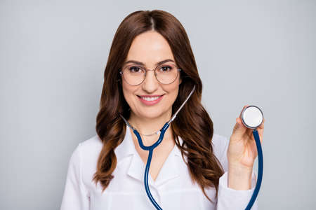 Close-up portrait of her she nice attractive cheerful wavy-haired doc wearing specs examining client...