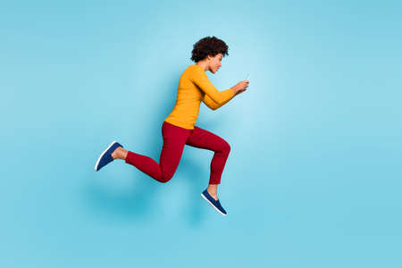Full length body size view of attractive lovely addicted focused wavy-haired girl jumping running...