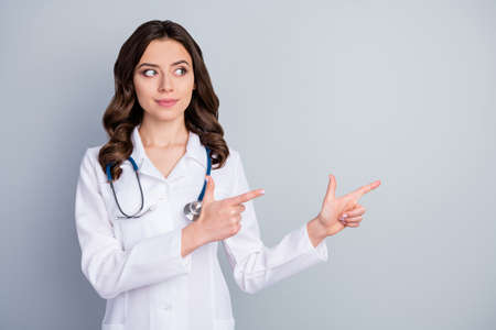 Photo of beautiful doc lady virologist direct fingers empty space show pandemic rules disinfection...