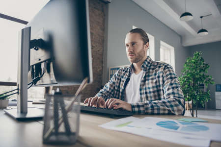 Photo of handsome business guy look computer monitor table chatting colleagues partners seriously...