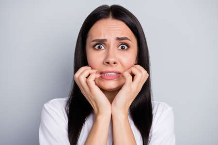 Portrait of frustrated anxious despair girl isolated over gray color background