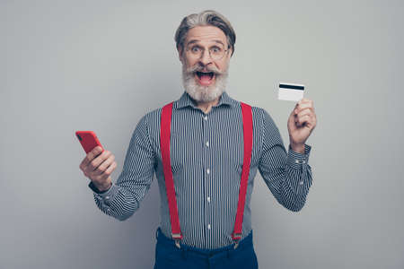 Portrait of his he nice attractive classy amazed overjoyed cheerful cheery man holding in hands...