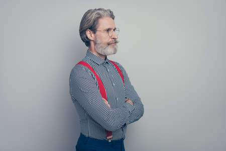 Profile side view portrait of his he nice attractive well-dressed imposing classy chic content man executive director leader folded arms isolated over gray pastel color backgroundの写真素材
