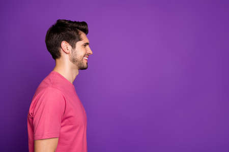 Profile side photo of candid content excited guy look copyspace listen his friend on spring free time weekend holiday wear stylish clothes isolated over vivid color backgroundの写真素材