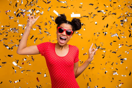 Portrait of wild carefree funky afro american clubber enjoy party rock weekend concert dance on discotheque wear red dotted t-shirt isolated over bright shine color backgroundの写真素材